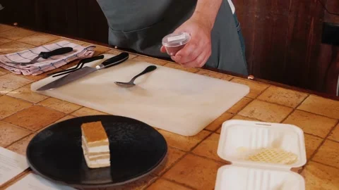 The chef on the stream prepares desserts with topping Stock Footage 169313457