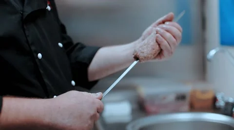 Chef stringing meat on a skewer Stock-Footage 67901275