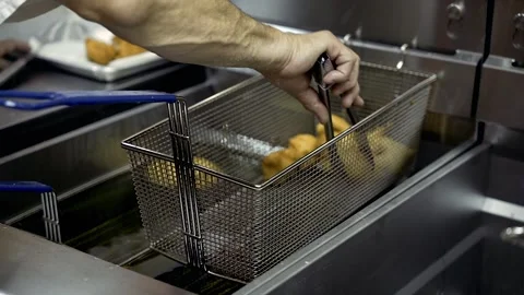 Chef struggles to get done zeppole from Fryer Williamsburg Brooklyn Stock Footage 252330698
