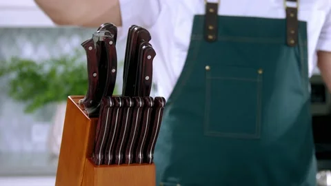 Chef takes the knife slow motion Stock Footage 236206666