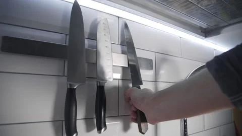Chef takes sharp knife before cooking Video stock 143779895