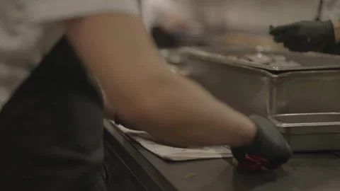 Chef taking food and tapping through cloth Stock Footage 336374479