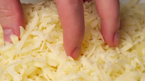 Chef taking grated cheese in slow motion Stock Footage 306195245