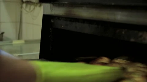 Chef taking off khachapuri from oven Stock Footage 65238431
