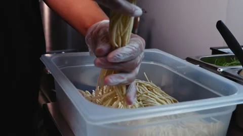 Chef Taking Noodles from Food Container Stock Footage 340026634