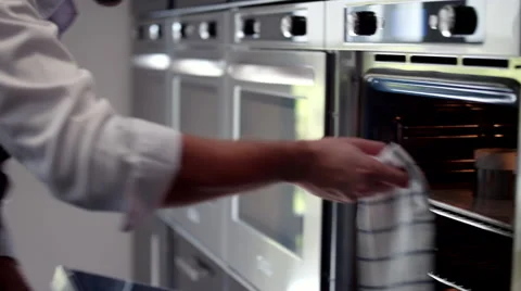 Chef taking out tray from oven. Stock Footage 64117214