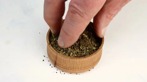 Chef taking spices Italian herbs, basil, oregano or provencal herbs from wooden Stock Footage 163502189