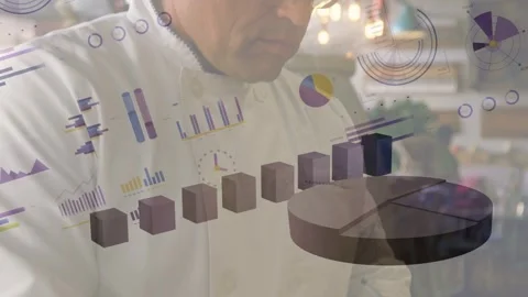 Chef tapping tablet leaning at kitchen counter watching 3D bars pie chart moving Stock Footage 333510531