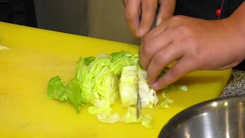 Chef teaches how to cut iceberg salad. Seafood salads Video stock 103280085
