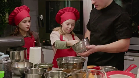 Chef Teaching Group of Children How to Cook in Culinary Class Stock Footage 339498140