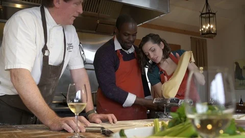 Chef teaching students how to use a dough roller Stock Footage 77081825