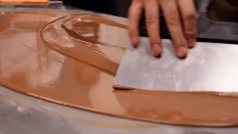 Chef tempering chocolate on a metal table at a master class. Close up Stock Footage 269464000