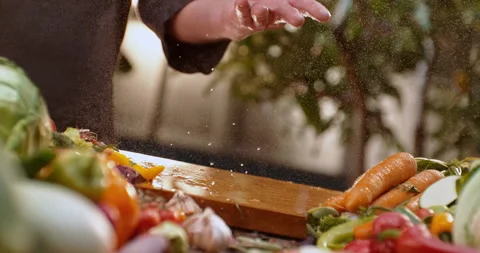 Chef throwing tomato on air and cutting Stock Footage 311832977
