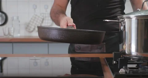 Chef throws chopped mushrooms in a frying pan. Fresh vegetables flying into the Stock Footage 260646600