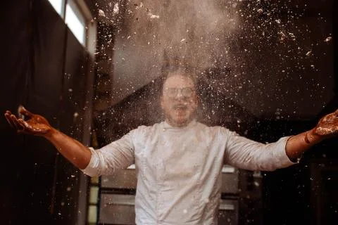 Chef throws flour and cocoa Stock Photos