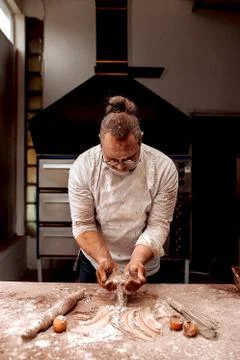 Chef throws flour and cocoa Stock Photos