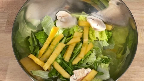 The chef throws ingredients into the salad Video stock 306803471