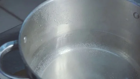 Chef throws the pasta in a pan of water Stock Footage 73816435