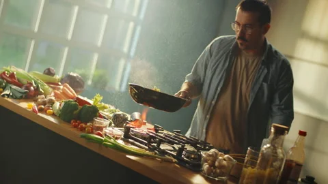 Chef throws vegetables in the air Stock Footage 311835071