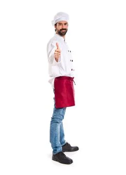 Chef with thumb up over white background Stock Photos