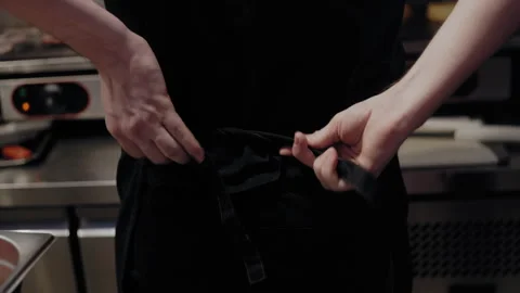 Chef Ties Apron Before Cooking in Kitchen 스톡 동영상 307082900
