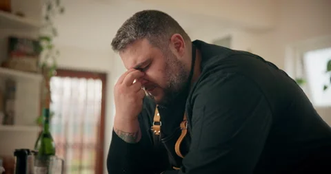 Chef, tired and thinking in kitchen, headache and man with burnout in restaurant Stock Footage 283446675