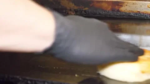 Chef Toasting Burger Bun on Flat Top Griddle, Close-Up Stock-Footage 347689537