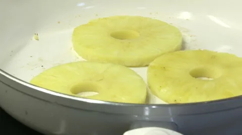 Chef toasting pineapple on a pan  Stock Footage 47966460