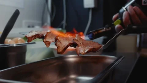 Chef Torch Grilling Meat on a Metal Spatula Video stock 340194062