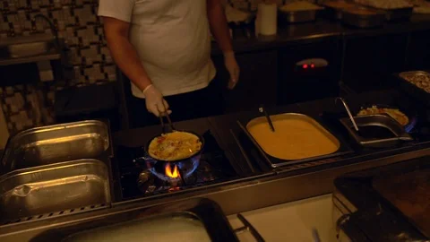 Chef tossing an egg and vegetable omellete Stock Footage 108113355