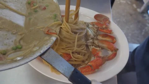 Chef Tossing Fresh Seafood Pasta in Pan with Cream Sauce, Close Up Video stock 337677702