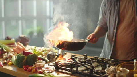 Chef tossing multicolored vegetables Stock Footage 311835044