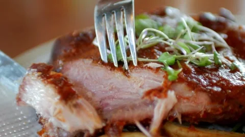 A chef with trained hands cuts the beef into thin slices, cinematic video 库存影片 336581615