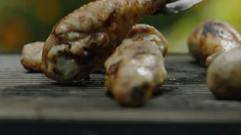 Chef Turn Chicken or Duck Leg with Tongs Closeup Stock Footage 145249021