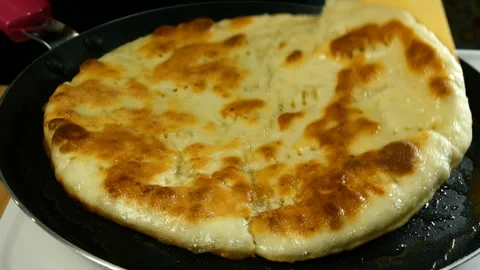 Chef turn freshly roasted flatbread. Stock Footage 131440113