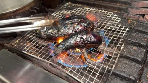 Chef Turning Charred Eggplants With Tongs Over Open Flame Yaki Nasu Japan Stock Footage 344645926