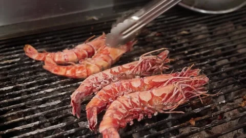 Chef Turning Fresh Jumbo Prawns on a Barbecue Grill Видео 344230903