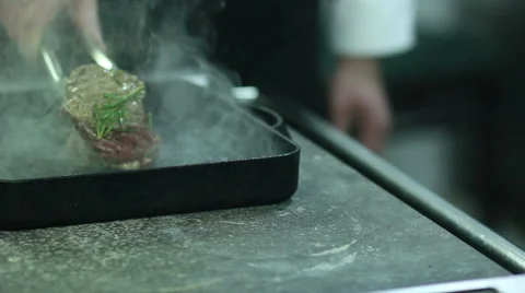 Chef turning  steaks on grill pan 스톡 동영상 61851913