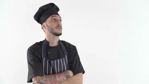 Chef in uniform thinking what to cook Stock Footage 144680563