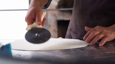 Chef use slicing wheel cutting fresh pizza, medium shot slow motion Stock Footage 122195688