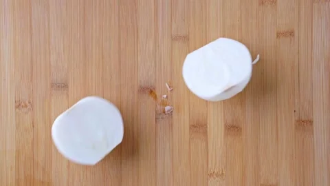 The chef uses a knife to cut the onion on the cutting board. Fresh onion sliced  Stock Footage 145139265