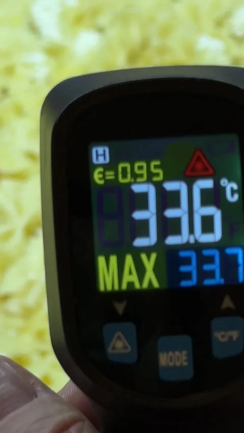 A chef uses a pyrometer to measure the temperature of pasta during cooking, e Stock Footage 282814565