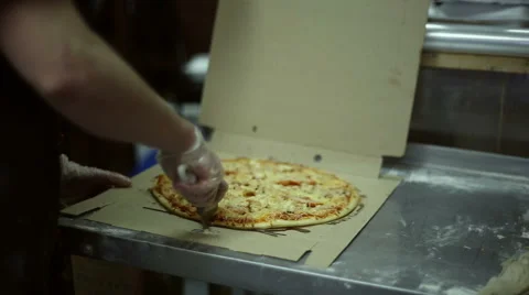 The chef uses roller knife to cut pizza Stock Footage 59700223