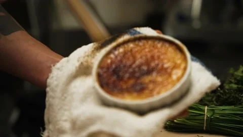 Chef using blow torch to make creme brulee slow motion 4k 30p Stock Footage 169227419