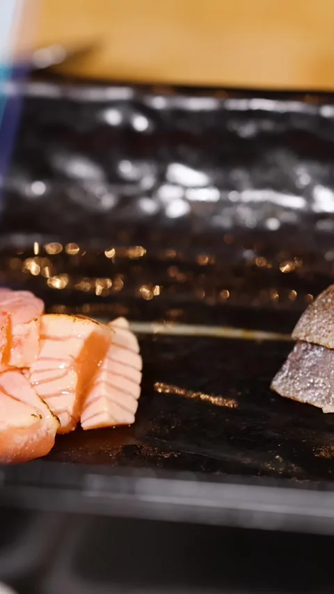 Chef Using Blowtorch to Sear Fresh Salmon and White Fish Nigiri Stock Footage 325690016