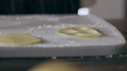 Chef using a circular ring to cut small pieces of potatoes in interior kitchen w Stock Footage 199460100