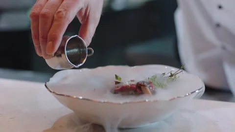 Chef using CO2 to decorate the dish Stock Footage 283006610