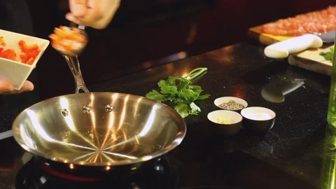 Chef using a frying pan to brown the make a dressing Stock Footage 91046867