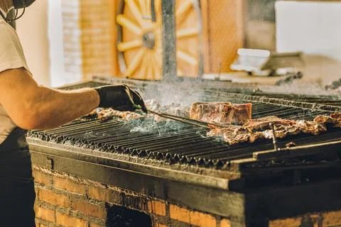 Chef Using Grill for Meat Stock Photos