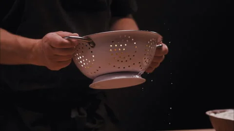 A chef using Italian Linguini Strainer in slow motion Stock Footage 254858193